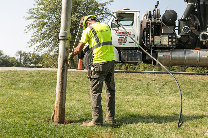 central cable worker laying cables in the country