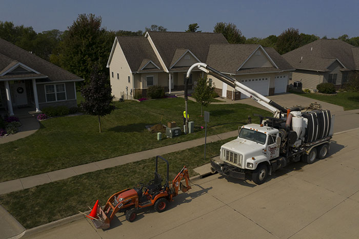 central cable workers working on a home cable box