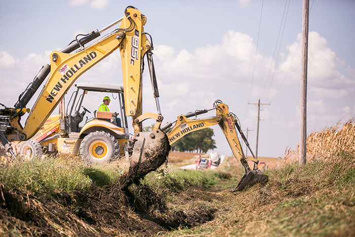 central cable worker driving a new holland machine