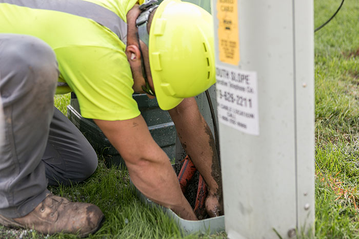 Central cable worker working on a cable box