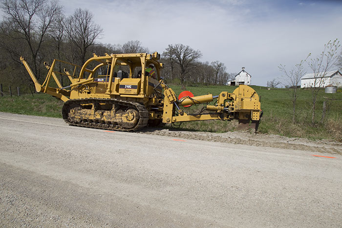 cable worker using an excavator at a work site