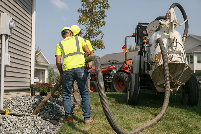 central cable worker placing cables at a home