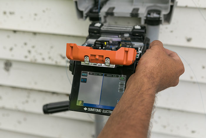 central cable worker installing a cable box