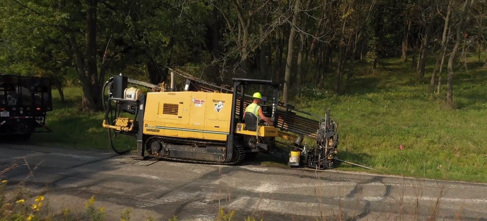 Central Cable worker using a machine to dig cables.