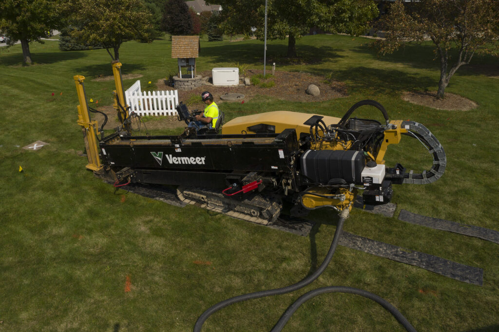 Central Cable worker driving a Vermeer machine