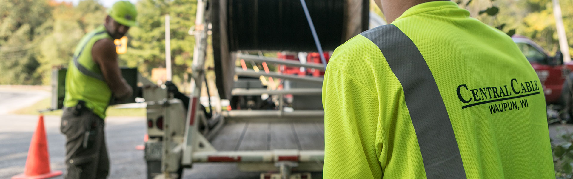 central cable worker with logo on his shirt