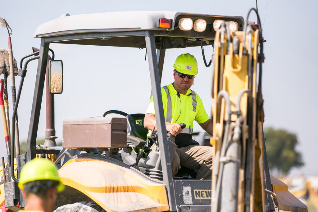 central cable worker driving a machine