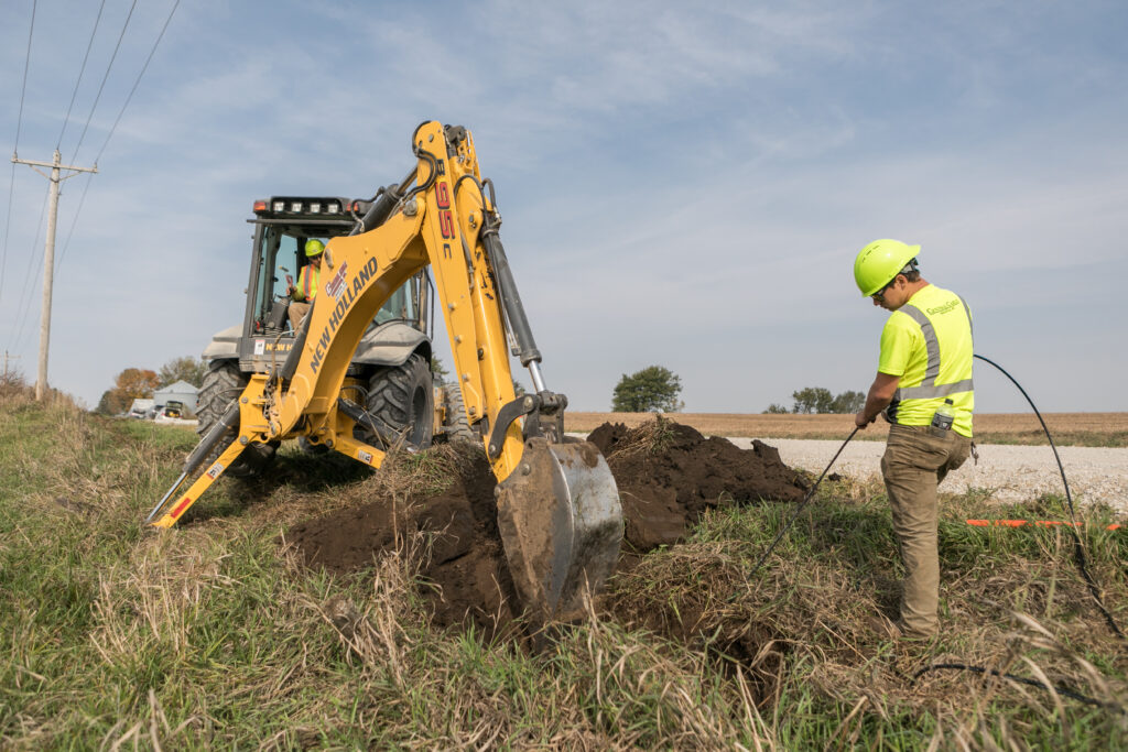 central cable worker laying cables in the country