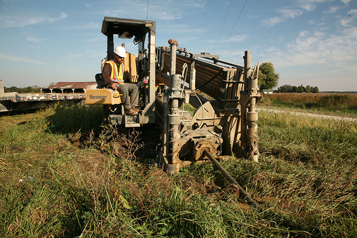 Central Cable worker driving a Vermeer machine