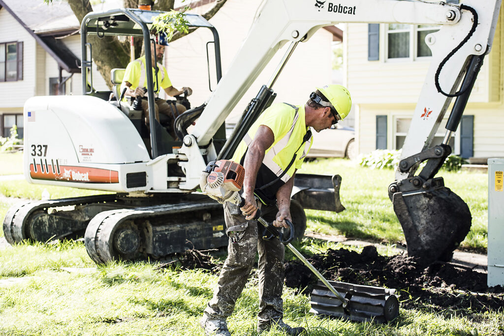 central cable worker flatting grass