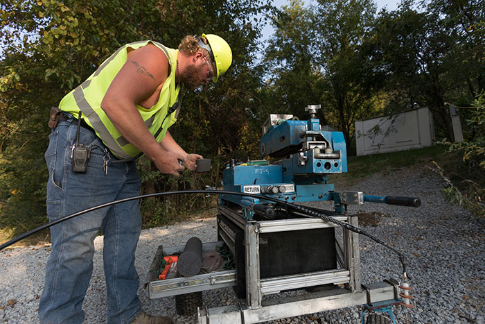 central cable worker cutting cables