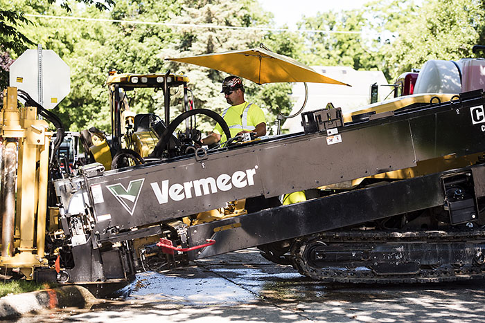 Central Cable worker driving a Vermeer machine