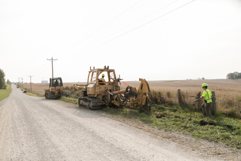 Central Cable worker driving a Vermeer machine