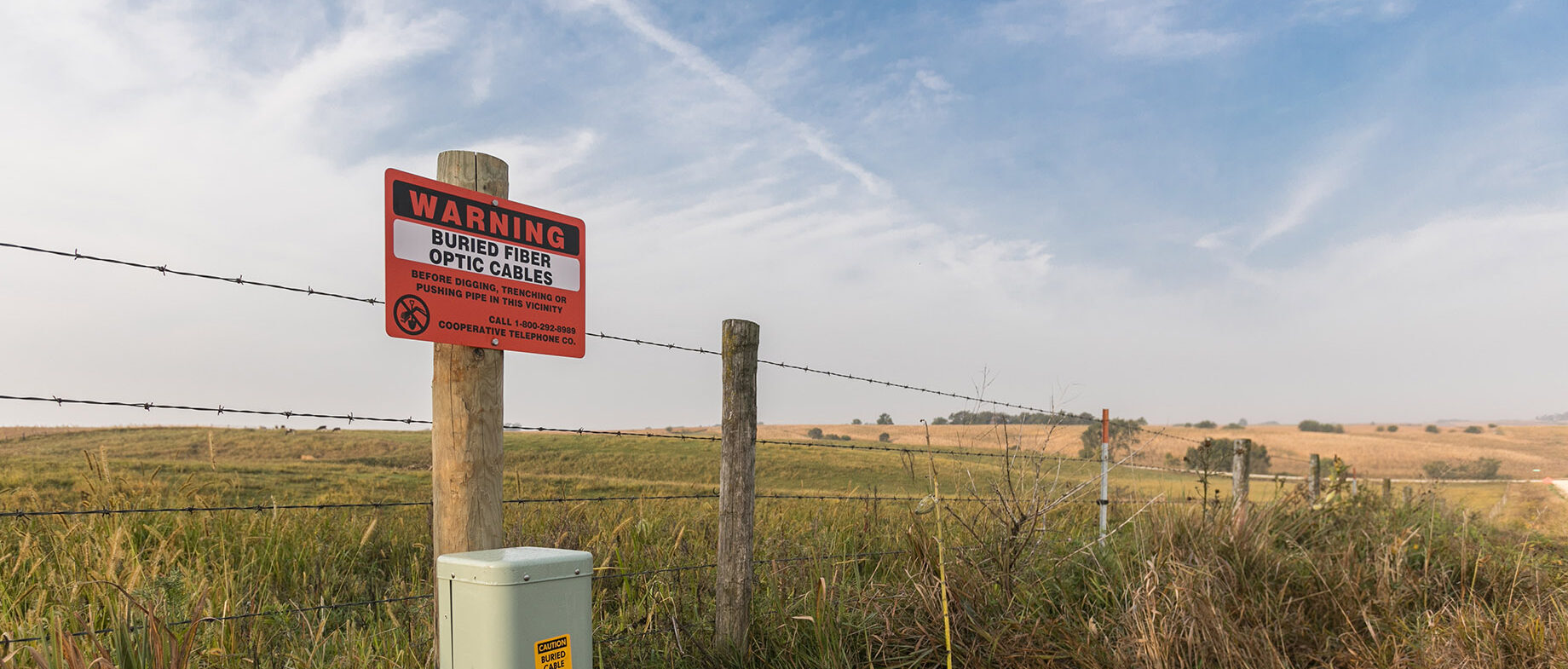 warming sign in the country for buried wires