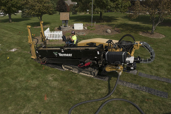 Central Cable worker driving a Vermeer machine