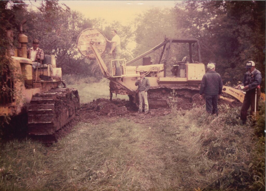 old photo of central cable workers talking