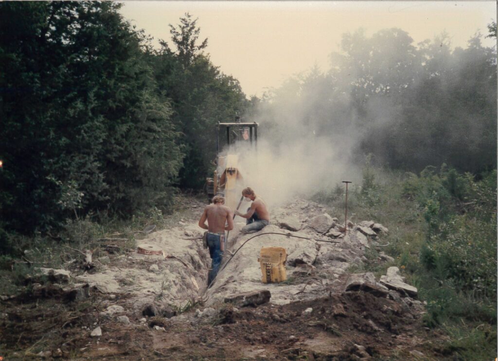 old photo of central cable workers breaking up concrete